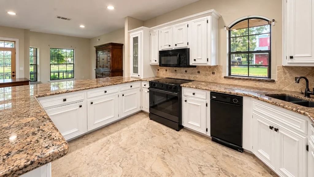 Merner's Painting & Decorating white kitchen cabinet painting in Houston, TX